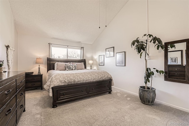 carpeted bedroom with high vaulted ceiling and a textured ceiling