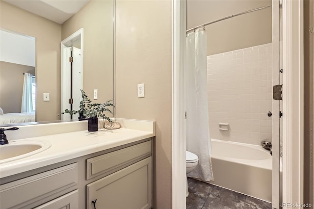 full bathroom with toilet, vanity, and shower / bath combo with shower curtain