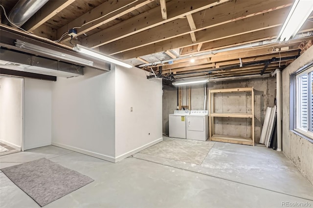 basement with washing machine and clothes dryer