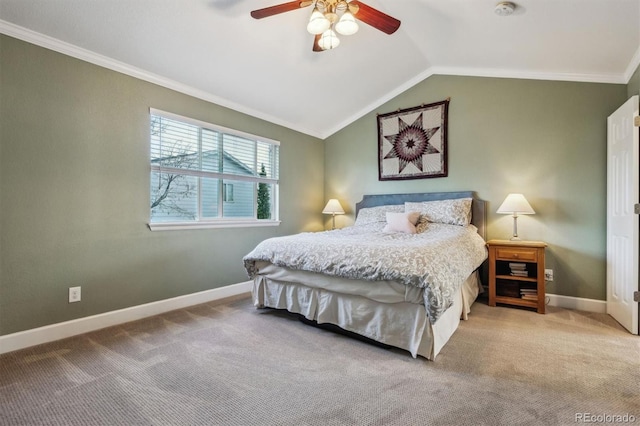 carpeted bedroom featuring baseboards, crown molding, vaulted ceiling, and ceiling fan