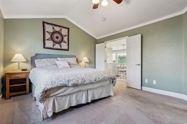 bedroom featuring carpet flooring, baseboards, crown molding, lofted ceiling, and a ceiling fan