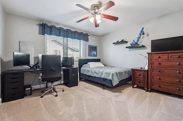 bedroom featuring carpet, a desk, and a ceiling fan