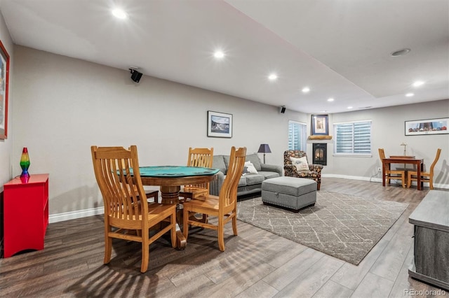 dining room with recessed lighting, wood finished floors, and baseboards