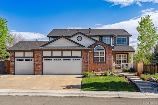 traditional home featuring an attached garage, driveway, brick siding, and roof with shingles