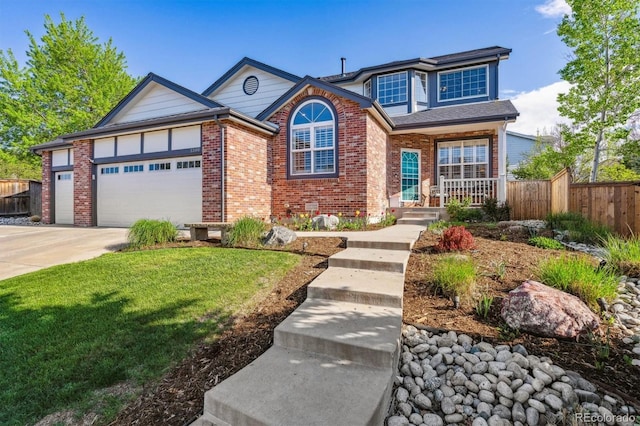 traditional home with brick siding, a garage, a porch, and concrete driveway