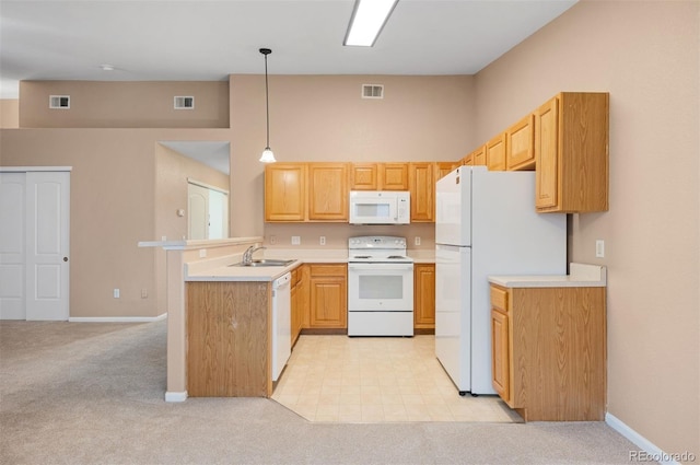 11640 W 62nd Pl Unit 203, Arvada, CO 80004 - kitchen with white appliances, a peninsula, light carpet, light countertops, and a high ceiling