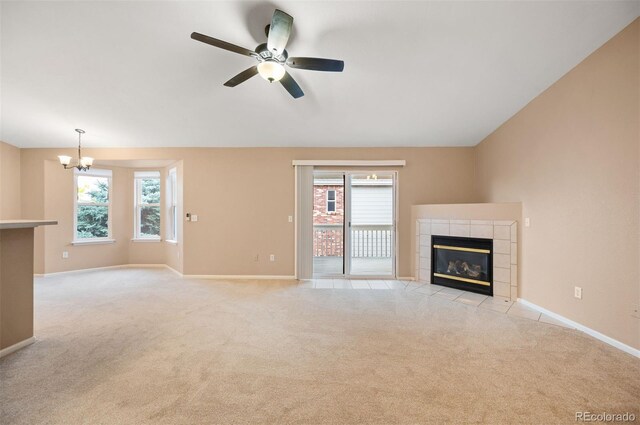 11640 W 62nd Pl Unit 203, Arvada, CO 80004 - unfurnished living room featuring a chandelier, light colored carpet, healthy amount of natural light, a fireplace, and vaulted ceiling