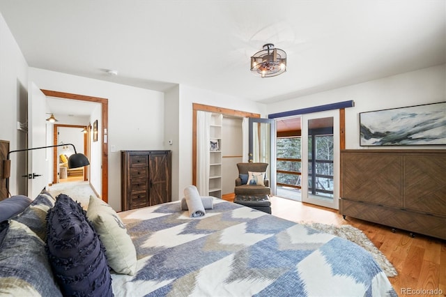 bedroom featuring access to outside and light hardwood / wood-style floors