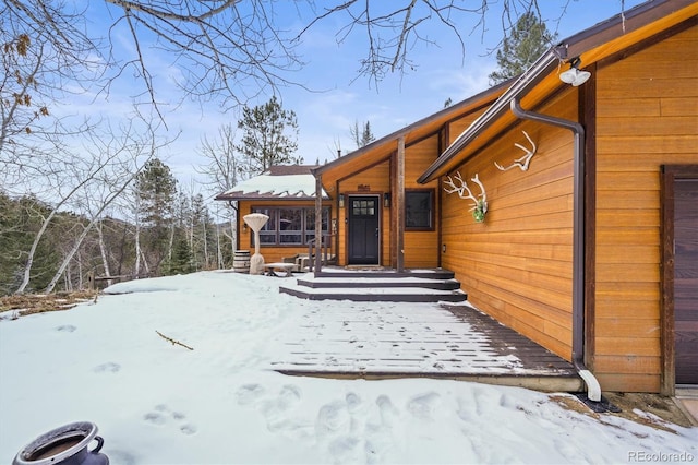 view of snow covered property