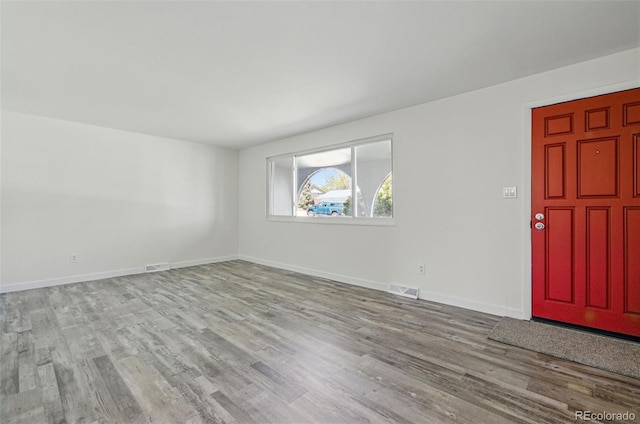 7065 Ingalls Ct, Arvada, CO 80003 - unfurnished room with wood finished floors and baseboards
