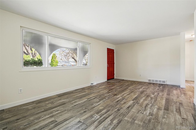 7065 Ingalls Ct, Arvada, CO 80003 - spare room with wood finished floors and baseboards