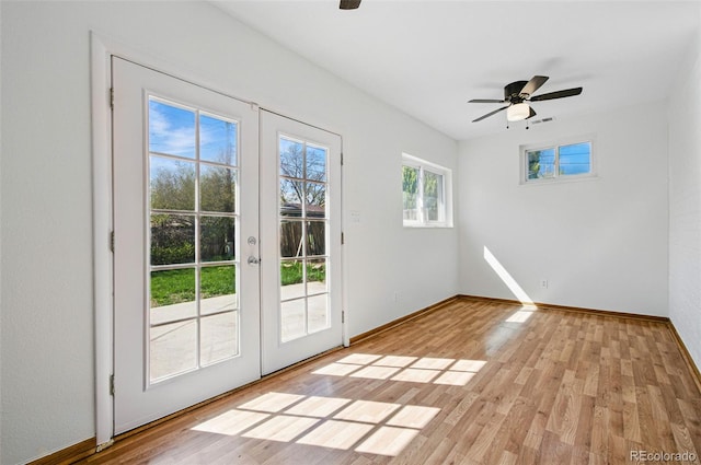 7065 Ingalls Ct, Arvada, CO 80003 - doorway to outside with french doors, ceiling fan, light wood-type flooring, and baseboards