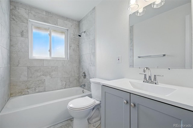 7065 Ingalls Ct, Arvada, CO 80003 - bathroom featuring toilet, vanity, and tub / shower combination