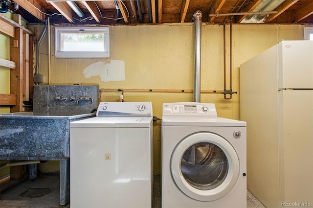 7065 Ingalls Ct, Arvada, CO 80003 - laundry room featuring separate washer and dryer
