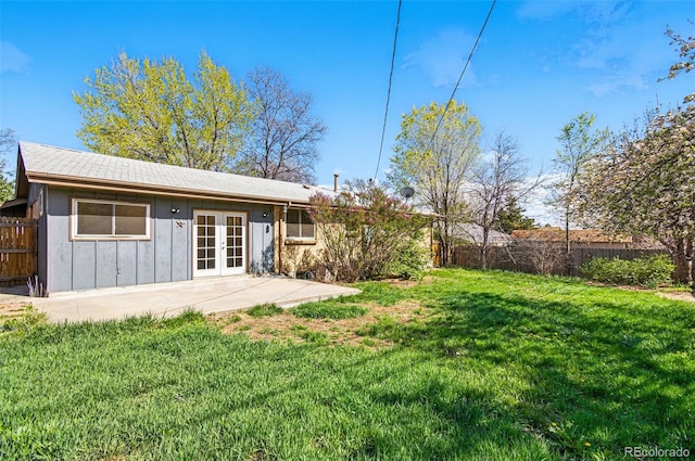 7065 Ingalls Ct, Arvada, CO 80003 - back of property featuring french doors, board and batten siding, and a patio area