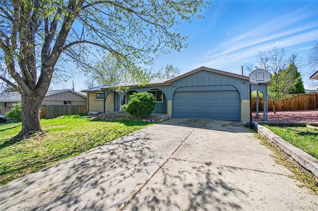 7065 Ingalls Ct, Arvada, CO 80003 - ranch-style house featuring a garage, brick siding, and driveway