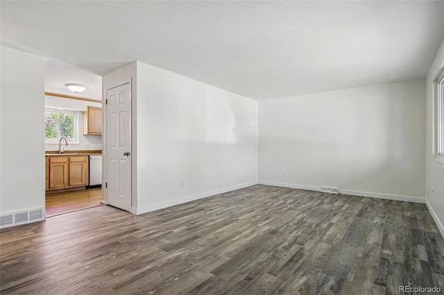 7065 Ingalls Ct, Arvada, CO 80003 - unfurnished room with a sink, dark wood-style floors, and baseboards