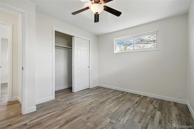 7065 Ingalls Ct, Arvada, CO 80003 - unfurnished bedroom featuring wood finished floors, a closet, baseboards, and ceiling fan