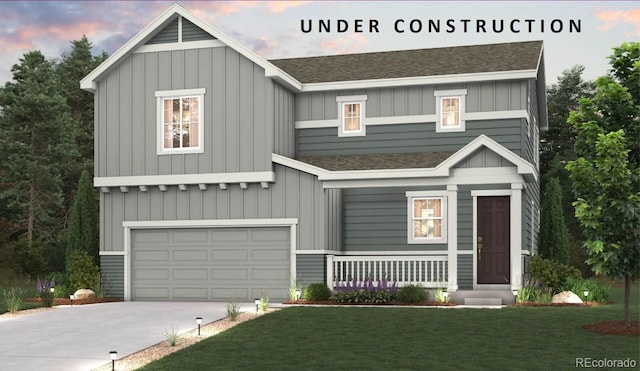 craftsman inspired home featuring a garage, a yard, and covered porch