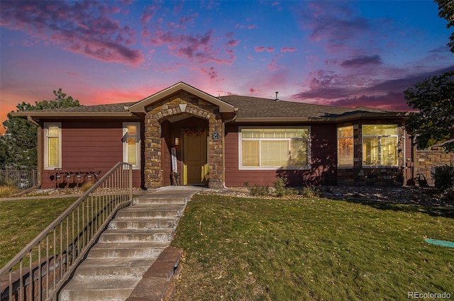 view of front of property with a lawn