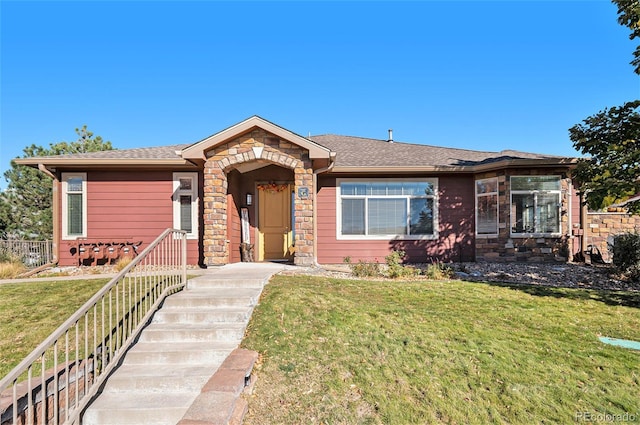 ranch-style house with a front lawn