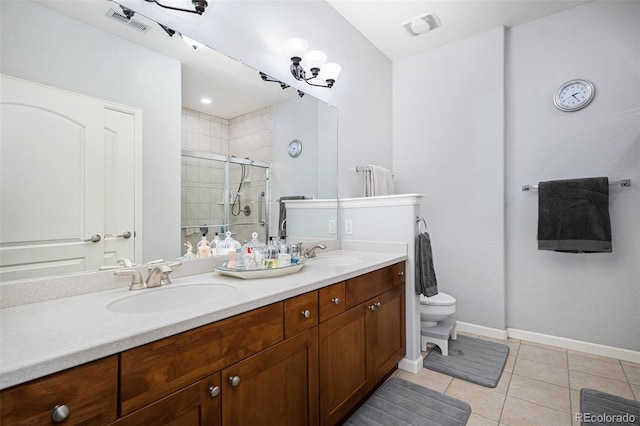 bathroom featuring a shower with door, toilet, tile patterned flooring, and vanity