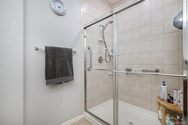 bathroom with a shower with shower door