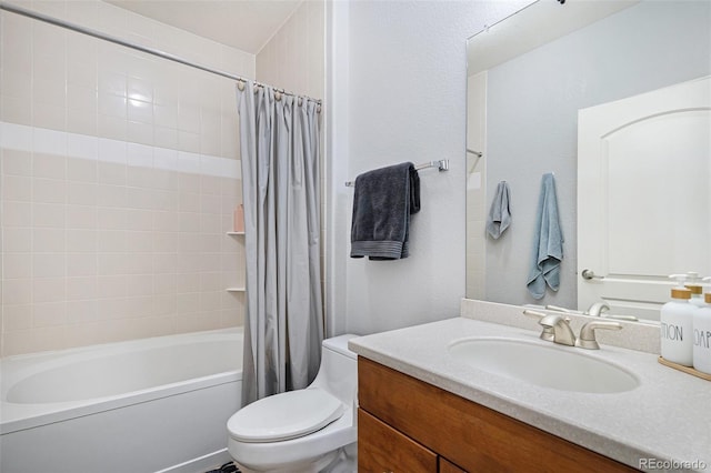 full bathroom featuring vanity, shower / tub combo with curtain, and toilet