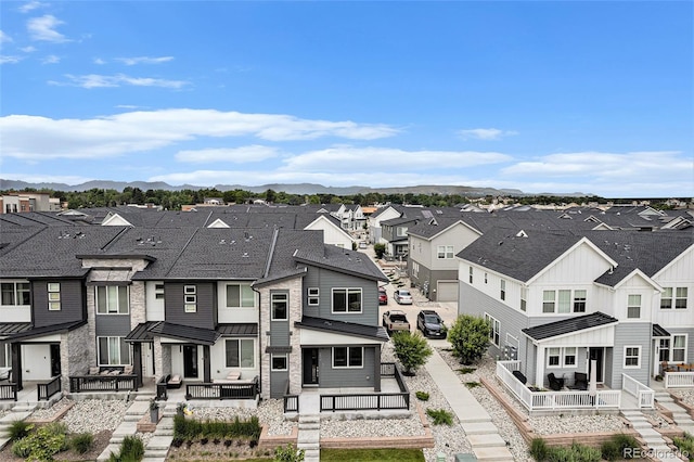 2054 S Upham Way, Denver, CO 80227 - rear view of property featuring a residential view, a mountain view, and a standing seam roof