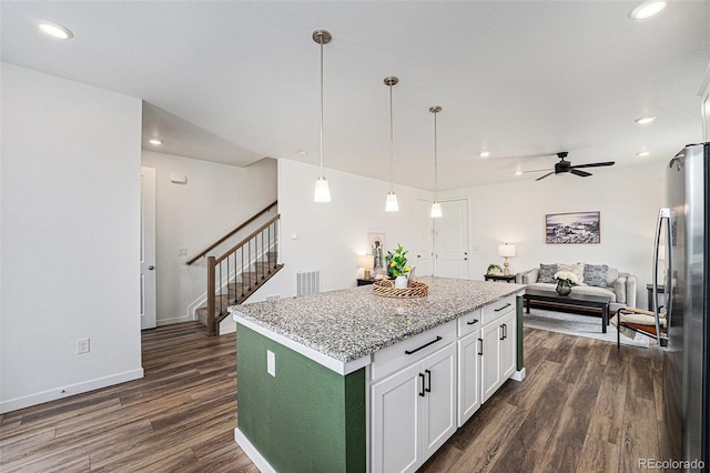 2054 S Upham Way, Denver, CO 80227 - kitchen with freestanding refrigerator, dark wood finished floors, white cabinetry, recessed lighting, and a ceiling fan