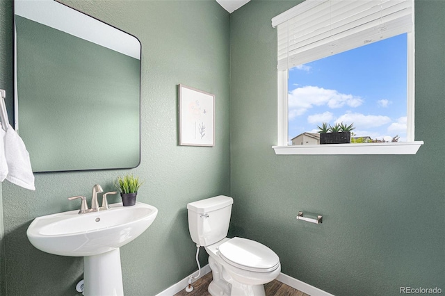 2054 S Upham Way, Denver, CO 80227 - bathroom featuring wood finished floors and toilet