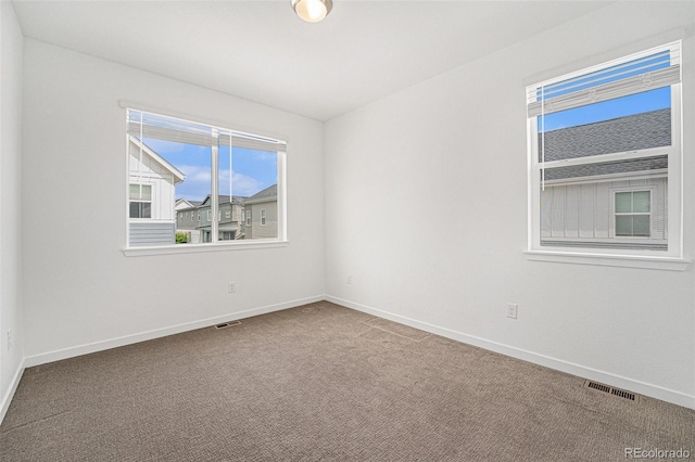 2054 S Upham Way, Denver, CO 80227 - unfurnished room with carpet and plenty of natural light