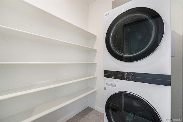 2054 S Upham Way, Denver, CO 80227 - laundry room with estacked washer and dryer and tile patterned floors