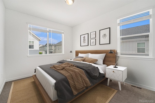 2054 S Upham Way, Denver, CO 80227 - carpeted bedroom featuring multiple windows