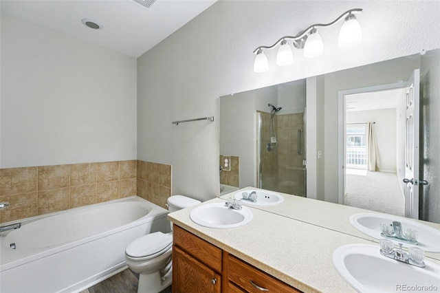 9434 Ashbury Cir Unit 203, Parker, CO 80134 - full bathroom with a shower stall, a bath, double vanity, and toilet