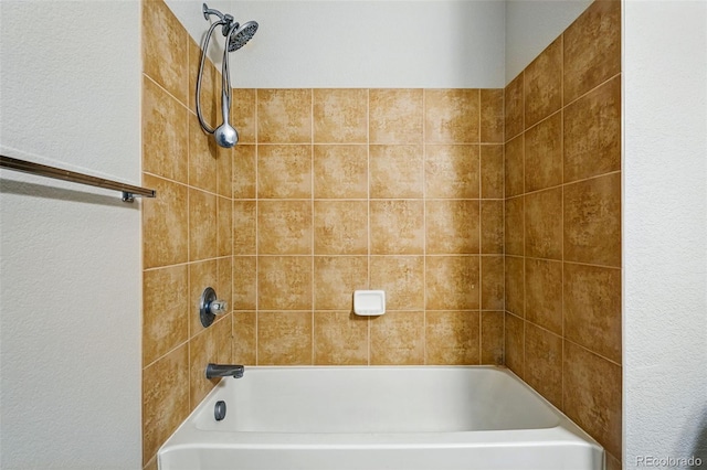 9434 Ashbury Cir Unit 203, Parker, CO 80134 - bathroom featuring shower / bath combination and a textured wall