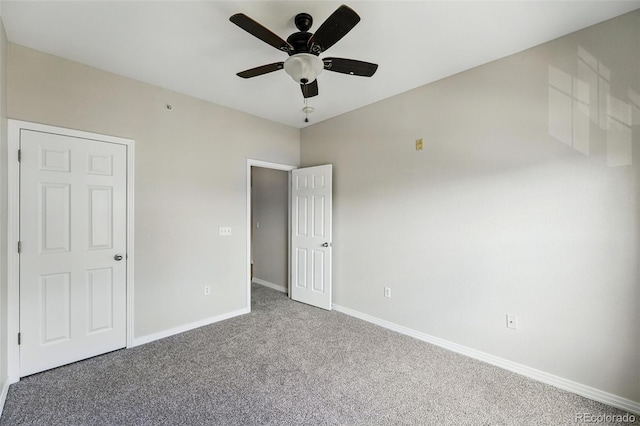 9434 Ashbury Cir Unit 203, Parker, CO 80134 - unfurnished bedroom featuring carpet, baseboards, and ceiling fan