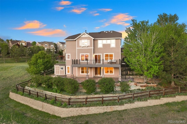 back of property featuring a patio, a deck, and fence