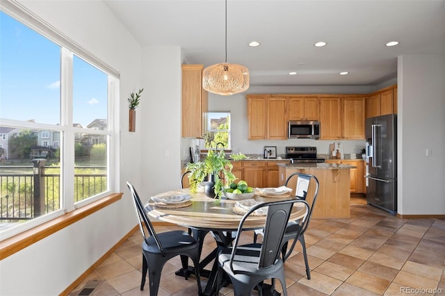 dining space featuring plenty of natural light, recessed lighting, baseboards, and light tile patterned floors