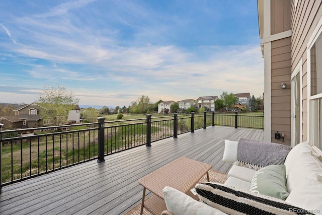 wooden deck with a residential view and an outdoor living space