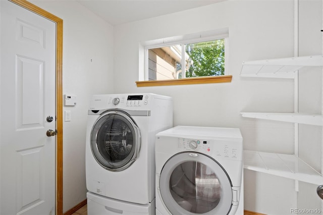 clothes washing area featuring washer and dryer