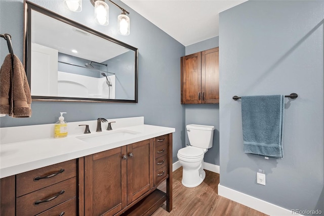 1346 S Grant St, Longmont, CO 80501 - full bath featuring vanity, wood finished floors, and a shower