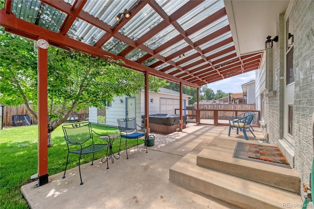 1346 S Grant St, Longmont, CO 80501 - fenced backyard featuring a hot tub, an outdoor structure, and a patio