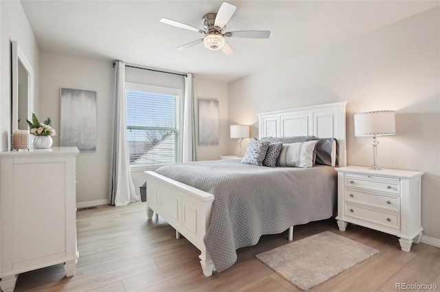 bedroom featuring light wood-type flooring and ceiling fan