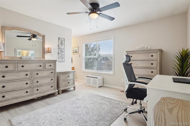 office area with light wood-type flooring and ceiling fan