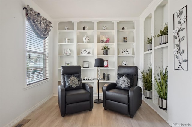 living area with light hardwood / wood-style floors