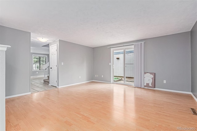 9328 Fenton Ct, Westminster, CO 80031 - empty room with wood finished floors, stairs, and a textured ceiling
