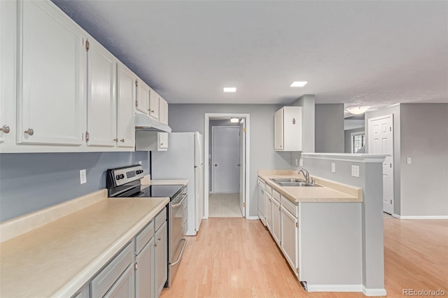 9328 Fenton Ct, Westminster, CO 80031 - kitchen with stainless steel range with electric stovetop, under cabinet range hood, light countertops, and light wood-style floors