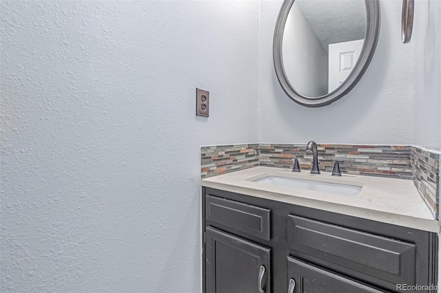 9328 Fenton Ct, Westminster, CO 80031 - bathroom featuring decorative backsplash and vanity