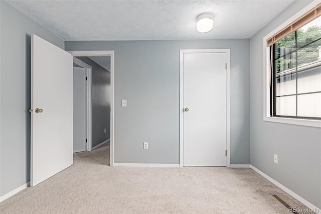 9328 Fenton Ct, Westminster, CO 80031 - unfurnished bedroom with a textured ceiling and carpet flooring